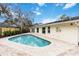 Inviting backyard pool with brick pavers, perfect for relaxation and entertaining at 5107 Saint Albans Ave, Sarasota, FL 34242