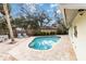 Beautiful pool area with brick pavers and outdoor seating at 5107 Saint Albans Ave, Sarasota, FL 34242