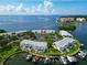 Stunning aerial view of waterfront condos with boat docks and beautiful blue water views at 5282 Beach Se Dr # D, St Petersburg, FL 33705