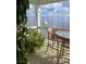 Balcony overlooking the water, featuring seating and serene view at 5282 Beach Se Dr # D, St Petersburg, FL 33705