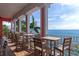 Relaxing balcony with ocean views and multiple tables, perfect for enjoying the coastal breeze at 5282 Beach Se Dr # D, St Petersburg, FL 33705