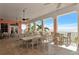 Charming balcony with multiple tables and chairs, offering stunning ocean views and a relaxing atmosphere at 5282 Beach Se Dr # D, St Petersburg, FL 33705