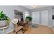 Cozy dining area with hardwood floors and view to kitchen at 5282 Beach Se Dr # D, St Petersburg, FL 33705