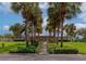 Beautiful home exterior with lush landscaping, including palm trees, and a brick walkway leading to the front door at 5282 Beach Se Dr # D, St Petersburg, FL 33705