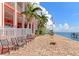 Exterior view of waterfront condos with patio seating and views of the sea at 5282 Beach Se Dr # D, St Petersburg, FL 33705