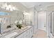 Elegant bathroom with double vanity and granite countertop at 5639 Rain Lily Ct, Sarasota, FL 34238