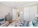 Spacious bedroom with double doors leading to the bathroom at 5639 Rain Lily Ct, Sarasota, FL 34238