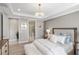 Spacious main bedroom with ensuite bathroom and walk-in closet at 5639 Rain Lily Ct, Sarasota, FL 34238