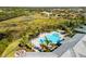 Resort-style community pool with lounge chairs and fire pit at 5639 Rain Lily Ct, Sarasota, FL 34238