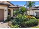 Beautiful house exterior with well-manicured landscaping at 5639 Rain Lily Ct, Sarasota, FL 34238