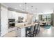 Open concept kitchen with island and adjacent dining area at 5639 Rain Lily Ct, Sarasota, FL 34238