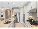 Modern kitchen, stainless steel appliances, granite countertops at 5639 Rain Lily Ct, Sarasota, FL 34238
