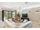Living area with access to pool and patio area at 5639 Rain Lily Ct, Sarasota, FL 34238