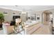 Spacious living room with large sectional sofa and chandelier at 5639 Rain Lily Ct, Sarasota, FL 34238