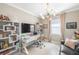 Home office with large TV and ample workspace at 5639 Rain Lily Ct, Sarasota, FL 34238