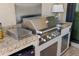 Stainless steel outdoor kitchen with granite countertops at 5639 Rain Lily Ct, Sarasota, FL 34238