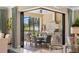 Outdoor kitchen with a built-in grill and dining area at 5639 Rain Lily Ct, Sarasota, FL 34238