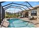 Inviting screened-in pool with patio furniture at 5639 Rain Lily Ct, Sarasota, FL 34238