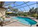 Screened-in pool and patio furniture at 5639 Rain Lily Ct, Sarasota, FL 34238