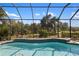 Screened-in pool with a spacious patio at 5639 Rain Lily Ct, Sarasota, FL 34238