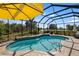 Relaxing screened-in pool with a large patio at 5639 Rain Lily Ct, Sarasota, FL 34238