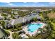 Resort-style pool and clubhouse with lounge chairs at 5639 Rain Lily Ct, Sarasota, FL 34238