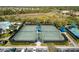 Community tennis courts with shade structures at 5639 Rain Lily Ct, Sarasota, FL 34238