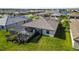 Aerial view of home with screened pool and backyard at 5429 Mystic Water Cv, Bradenton, FL 34211