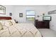 Spacious bedroom with a king-size bed and large window at 5429 Mystic Water Cv, Bradenton, FL 34211