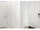 Interior hallway with white doors and neutral walls at 5429 Mystic Water Cv, Bradenton, FL 34211