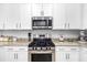 Stainless steel appliances and granite countertops in this kitchen at 5429 Mystic Water Cv, Bradenton, FL 34211