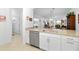 Kitchen with stainless steel dishwasher and white cabinets at 5429 Mystic Water Cv, Bradenton, FL 34211