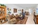 Open living room with access to the kitchen and dining areas at 5429 Mystic Water Cv, Bradenton, FL 34211