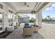 Covered patio with comfortable seating at 5429 Mystic Water Cv, Bradenton, FL 34211