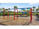 playground with swings and play structures at 5429 Mystic Water Cv, Bradenton, FL 34211