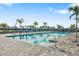 Community pool with lounge chairs and steps at 5429 Mystic Water Cv, Bradenton, FL 34211