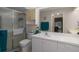 Bright bathroom with a walk-in shower, vanity, and toilet at 5441 18Th W Ct, Bradenton, FL 34207