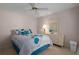Bright bedroom with a queen bed, ceiling fan, and dresser at 5441 18Th W Ct, Bradenton, FL 34207