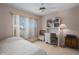 Well-lit bedroom with a large window, desk, and bed at 5441 18Th W Ct, Bradenton, FL 34207