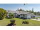 Charming single-story home with a well-maintained lawn and landscaped front yard at 5441 18Th W Ct, Bradenton, FL 34207