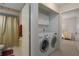 Convenient laundry area with washer and dryer located near the bathroom and bedroom at 5441 18Th W Ct, Bradenton, FL 34207