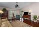 Cozy living room with hardwood floors, ceiling fan, and comfortable seating arrangement at 5441 18Th W Ct, Bradenton, FL 34207