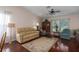 Bright living room with hardwood floors, large window, and neutral-colored sofa at 5441 18Th W Ct, Bradenton, FL 34207