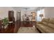 Open-concept space with dining area, living room, and kitchen; hardwood floors throughout at 5441 18Th W Ct, Bradenton, FL 34207