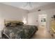 Comfortable bedroom with a large bed, ceiling fan, and en-suite bathroom at 5441 18Th W Ct, Bradenton, FL 34207