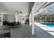 Outdoor living space with access to a screened pool and a convenient kitchenette at 5441 18Th W Ct, Bradenton, FL 34207