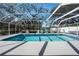 A refreshing screened-in pool featuring crystal clear water and lounge chairs at 5441 18Th W Ct, Bradenton, FL 34207