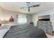 Bedroom showcasing striped window treatment, zebra accents, and modern ceiling fan at 5619 Bayshore Rd # 410, Palmetto, FL 34221