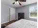 Bedroom with light gray walls, white door and trim, and hardwood floors at 5809 71St E St, Palmetto, FL 34221