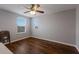 Bedroom with neutral walls, hardwood floors, and two windows at 5809 71St E St, Palmetto, FL 34221